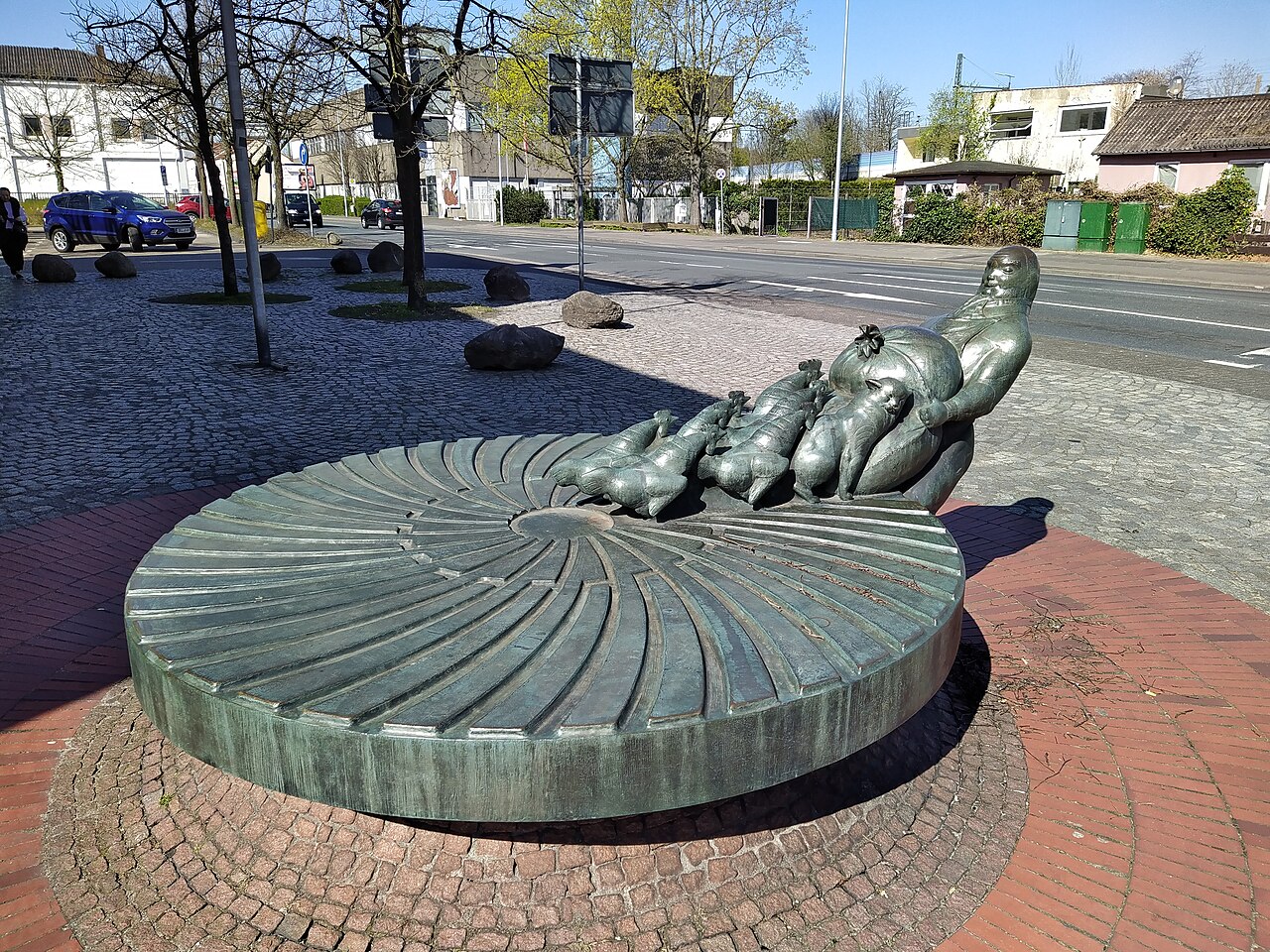 Skulptur "Der Auszug des Müllers" vor der Post in Delmenhorst