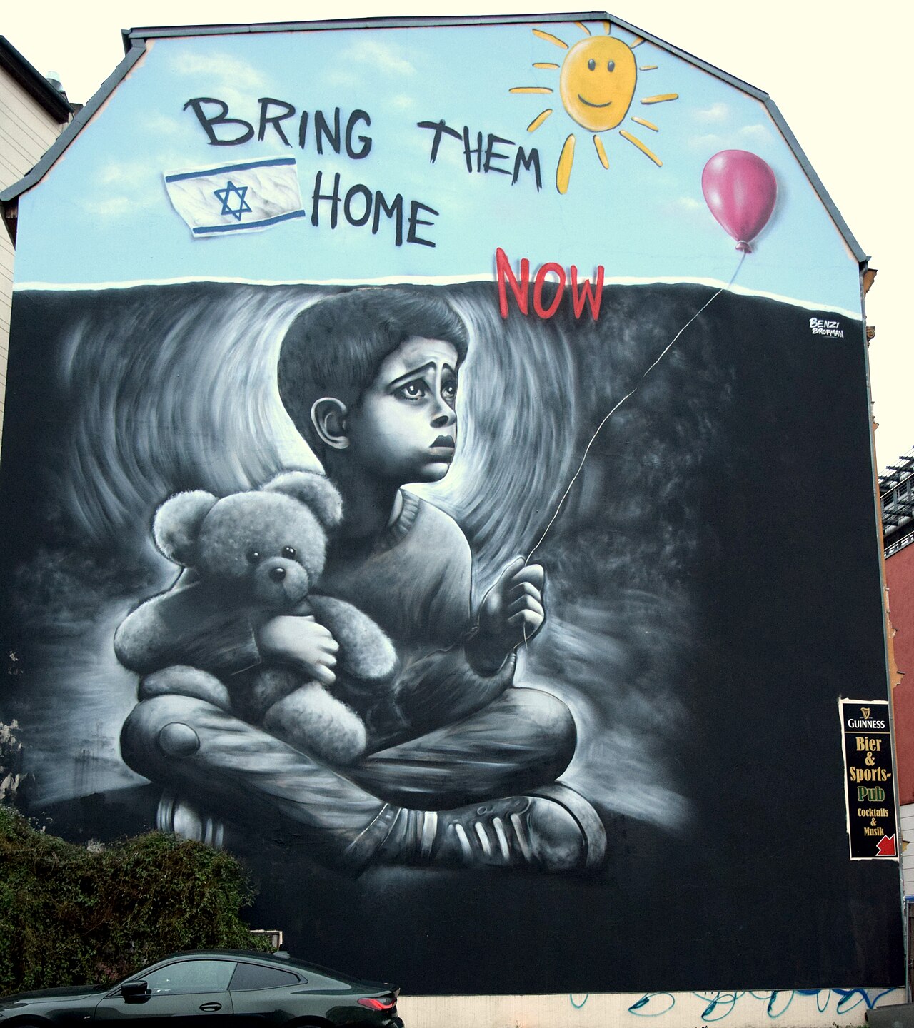 Mural "Bring Them Home" by Benzi in the Auguststraße 92 in Berlin-Mitte, Germany