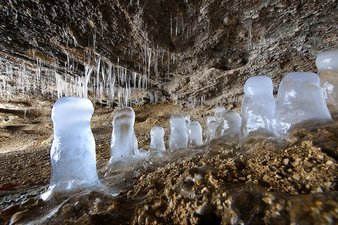 Cave with stalactites and stalagmites made of ice near Wackersberg, Bavaria, Germany, registered as geotope 173H001