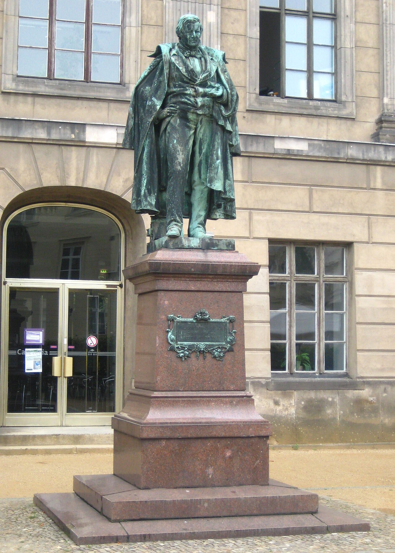 Statue of Eilhard Mitscherlich in front of the east wing of the main building of Humboldt University in Berlin-Mitte