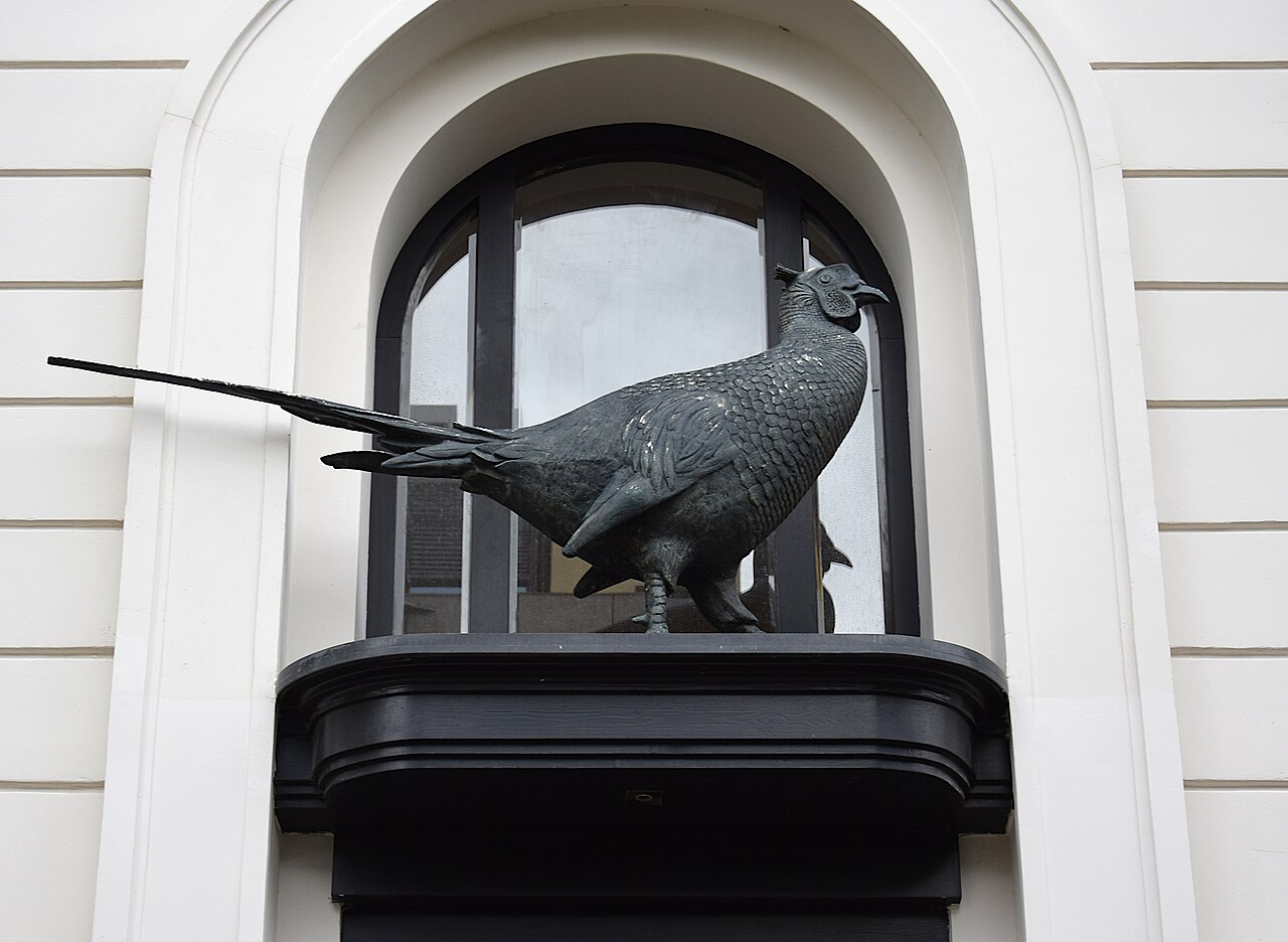 Sculpture of a pheasant by Bertold Grether at Fasanenstraße 65 in Berlin-Wilmersdorf, Germany