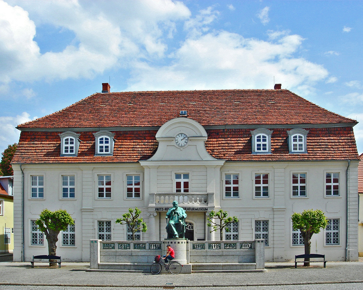 Former town hall of Stavenhagen , now a literature museum dedicated to Fritz Reuter (memorial of him in front of it)