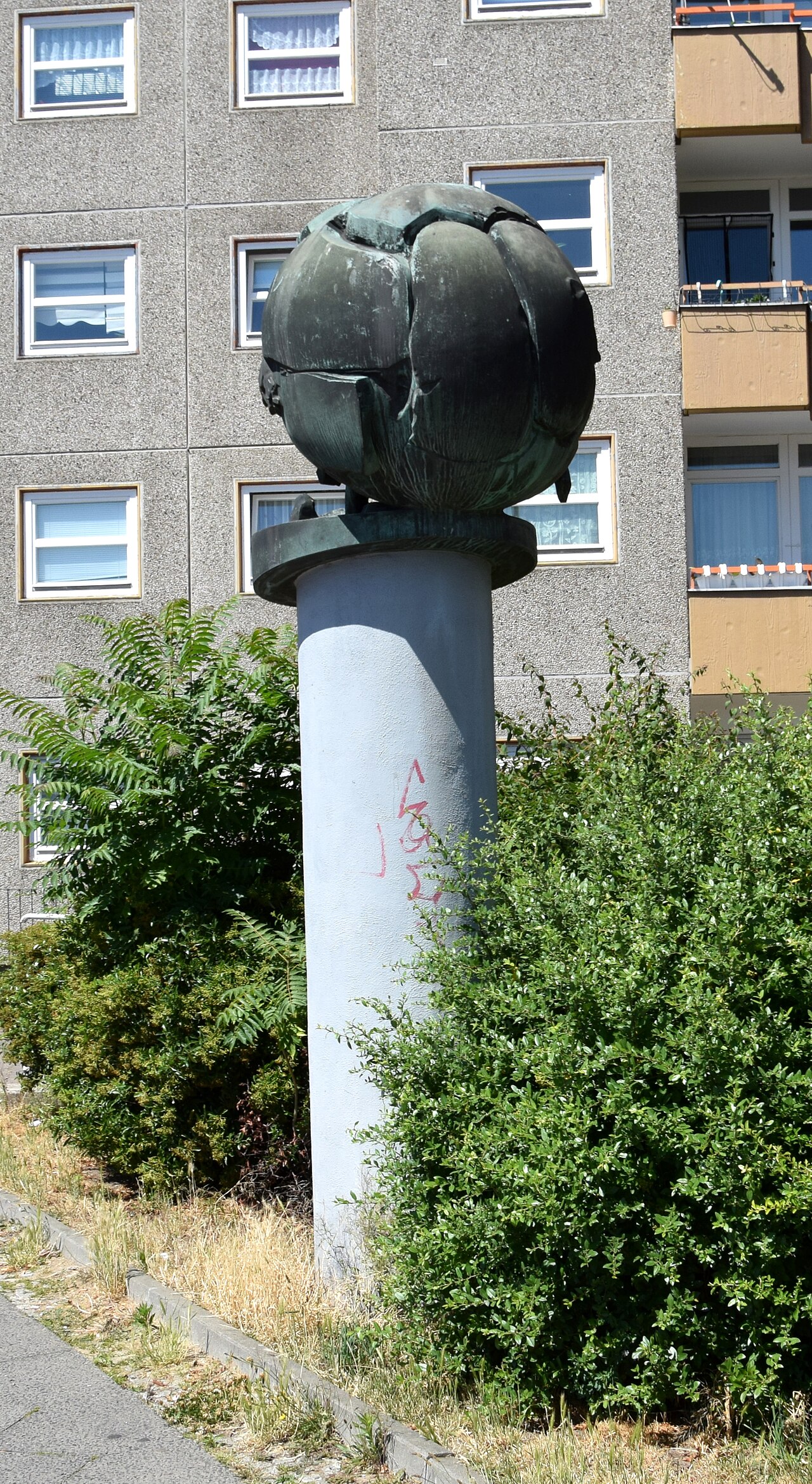 Sculpture "Football" by Michael Schoenholtz in the Bellermannstraße 64 in Berlin-Gesundbrunnen, Germany