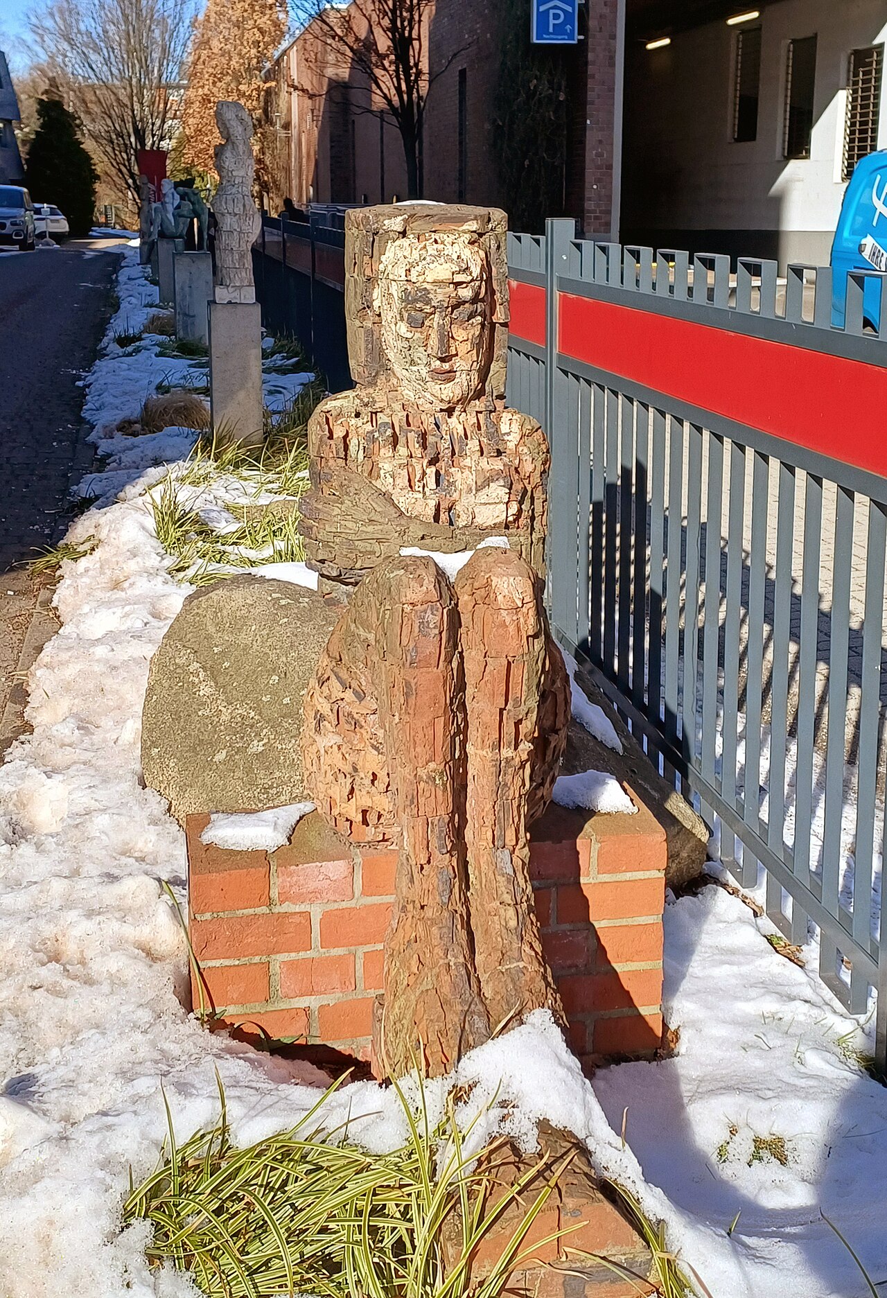 Sculpture, " Hockende mit Haube " by Sabine Heller , 1997, Breite Straße 22, Berlin-Pankow , Germany