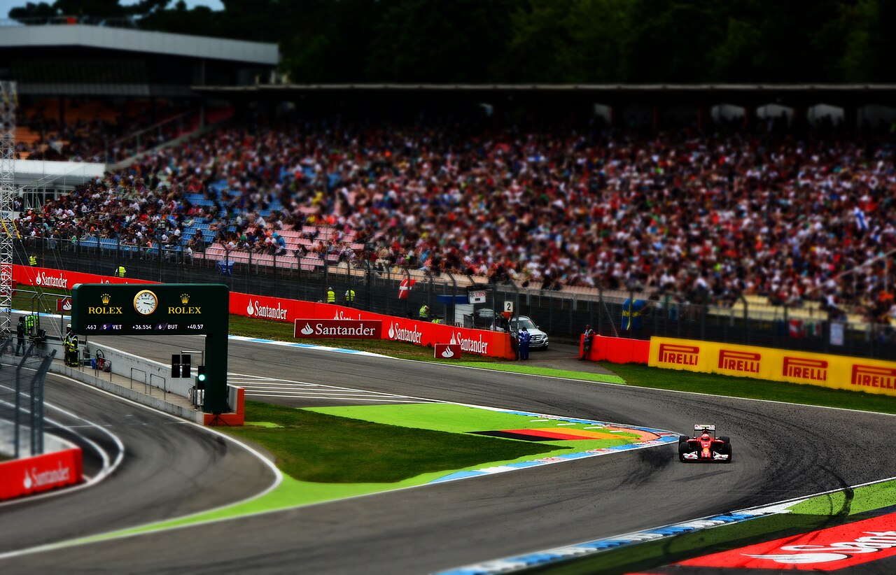 Kimi Raikkonen driving through the first turn of the Hockenheimring at the 2014 German Grand Prix