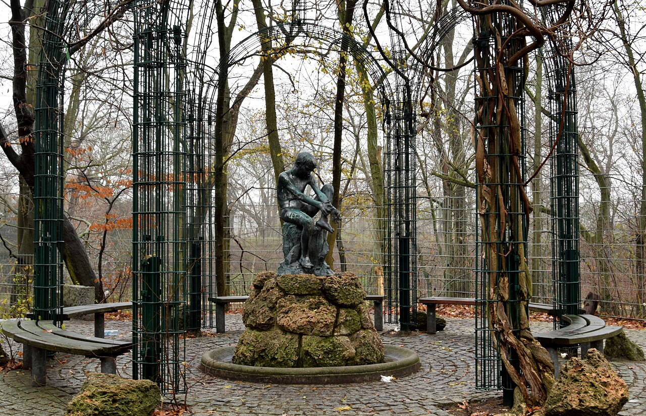 Tuff fountain and figure "Boy with Octopus" (Eduardo Rossi) in the Franckepark in Berlin-Tempelhof, Germany