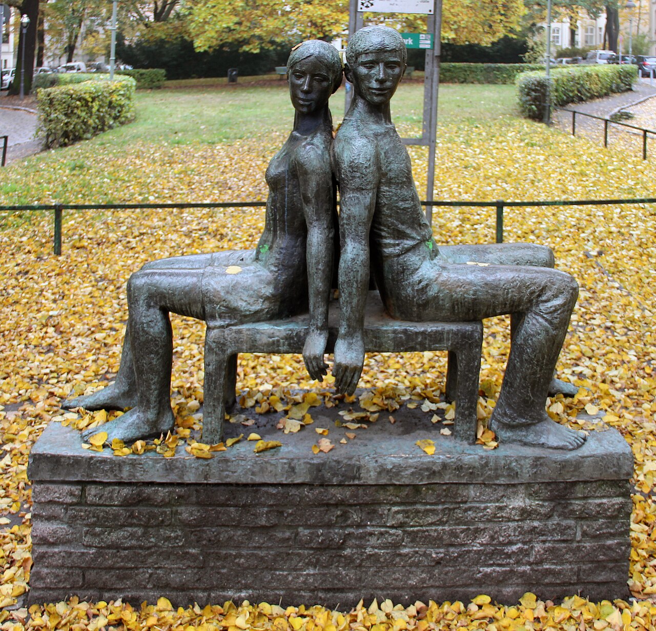 Sculpture, " Sitzendes Liebespaar " by Carin Kreuzberg , 1976, Amalienpark, Berlin-Pankow , Germany
