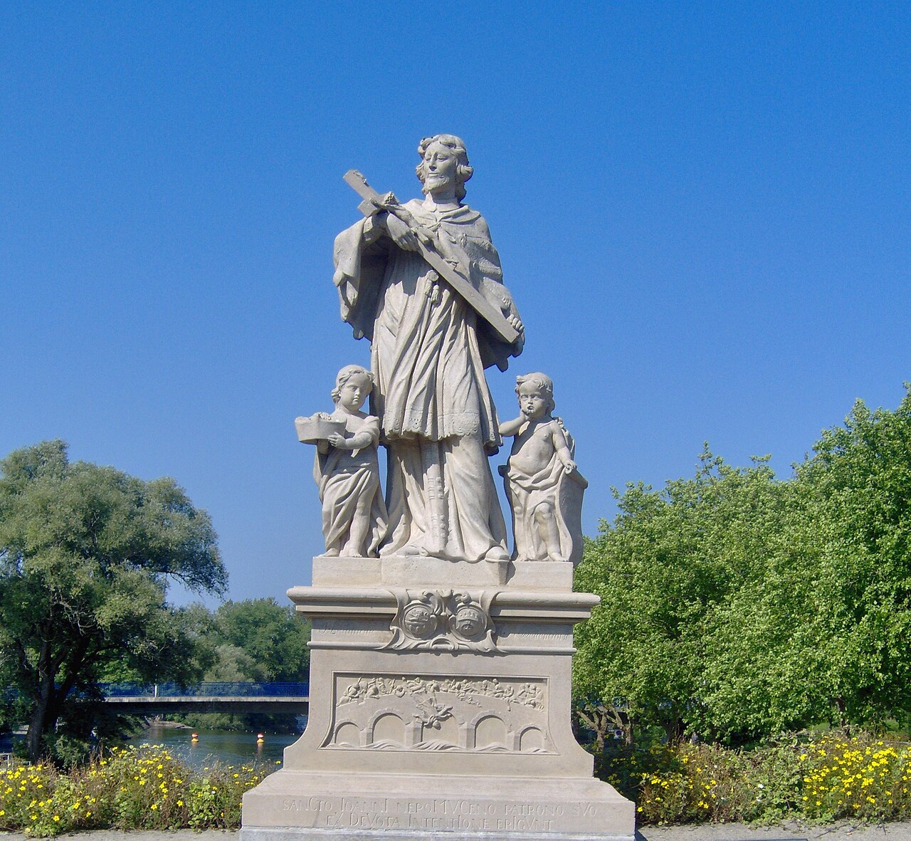 Statue of John of Nepomuk at the Ems river in Rheine , North Rhine-Westphalia , Germany
