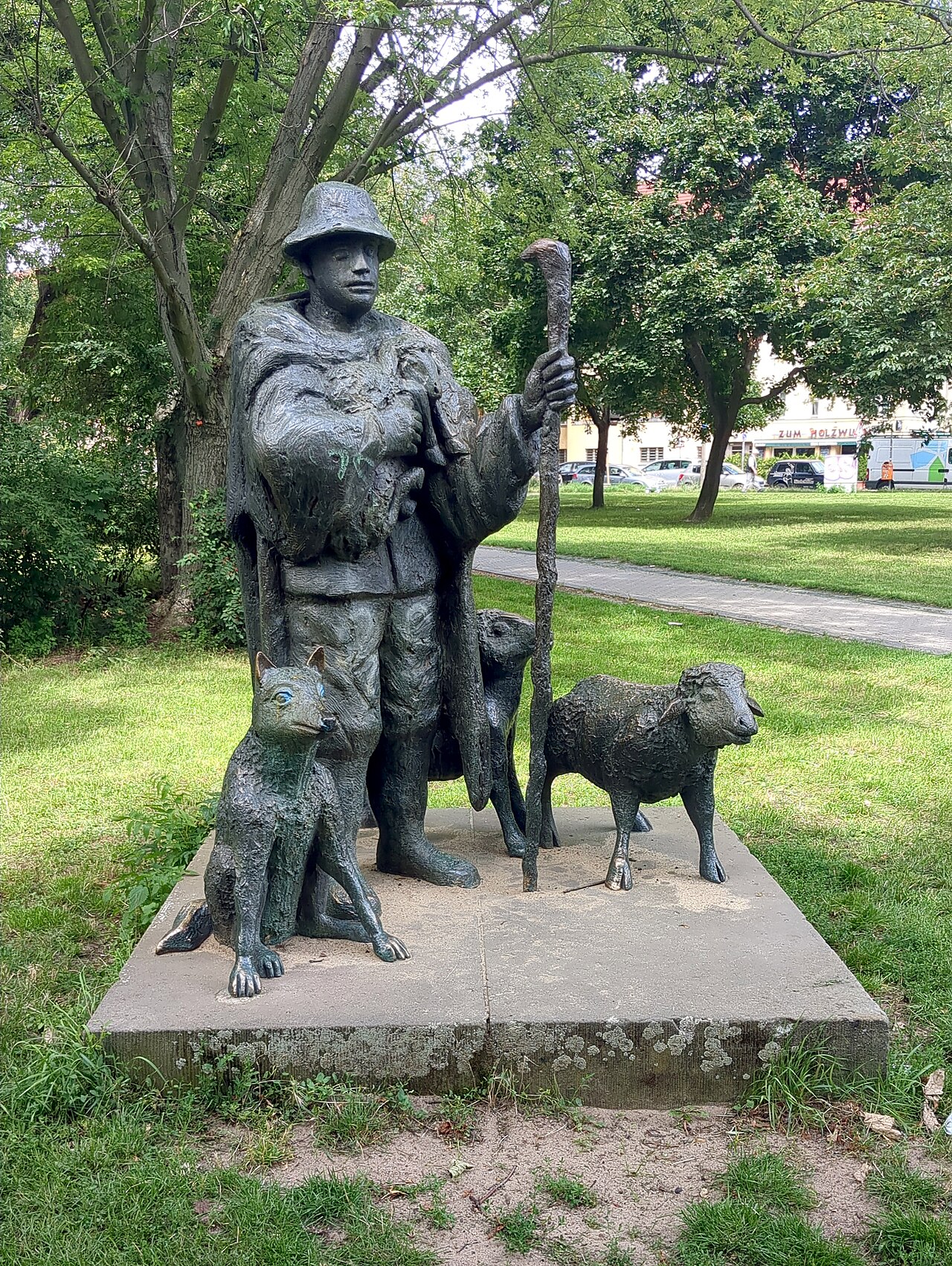 Sculpture Shepherd with dog and sheep by Werner Richter at Altenhofer Straße in Berlin-Alt-Hohenschönhausen, Germany