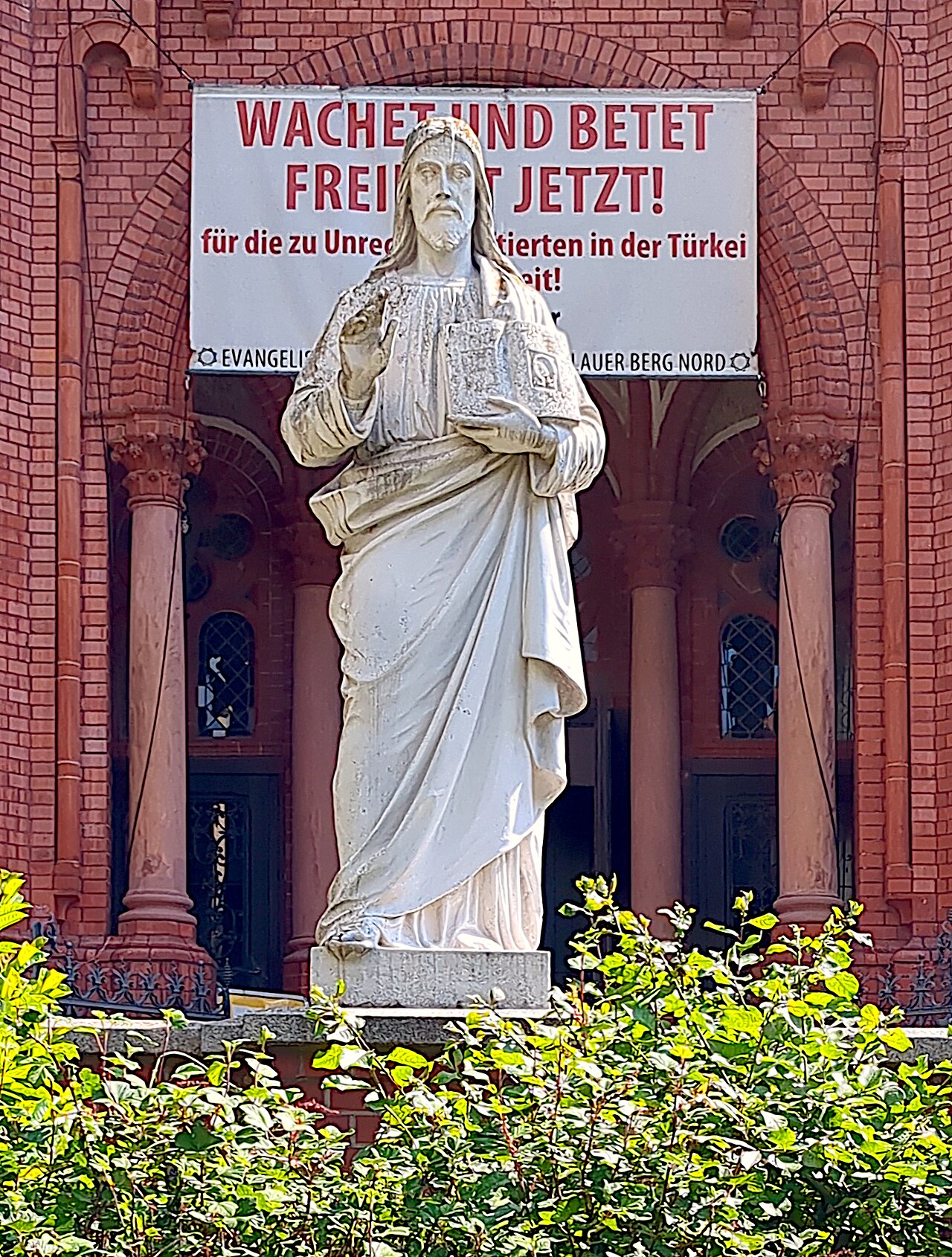 Sculpture “Christ the Blessing” by Abele in front of the Gethsemane Church in Berlin-Prenzlauer Berg, Germany