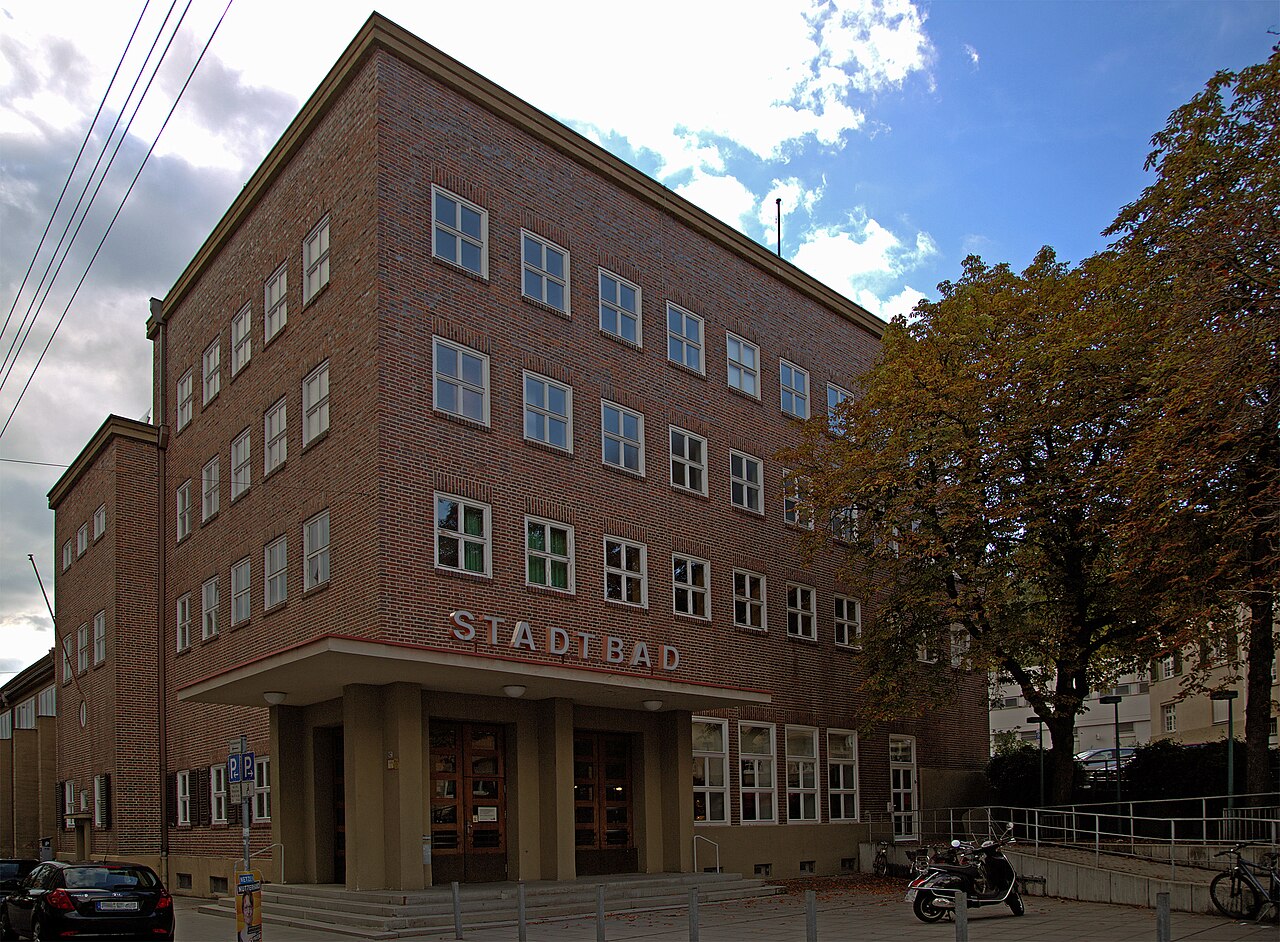 This is the front of the Hallenbad Heslach in the town of Stuttgart