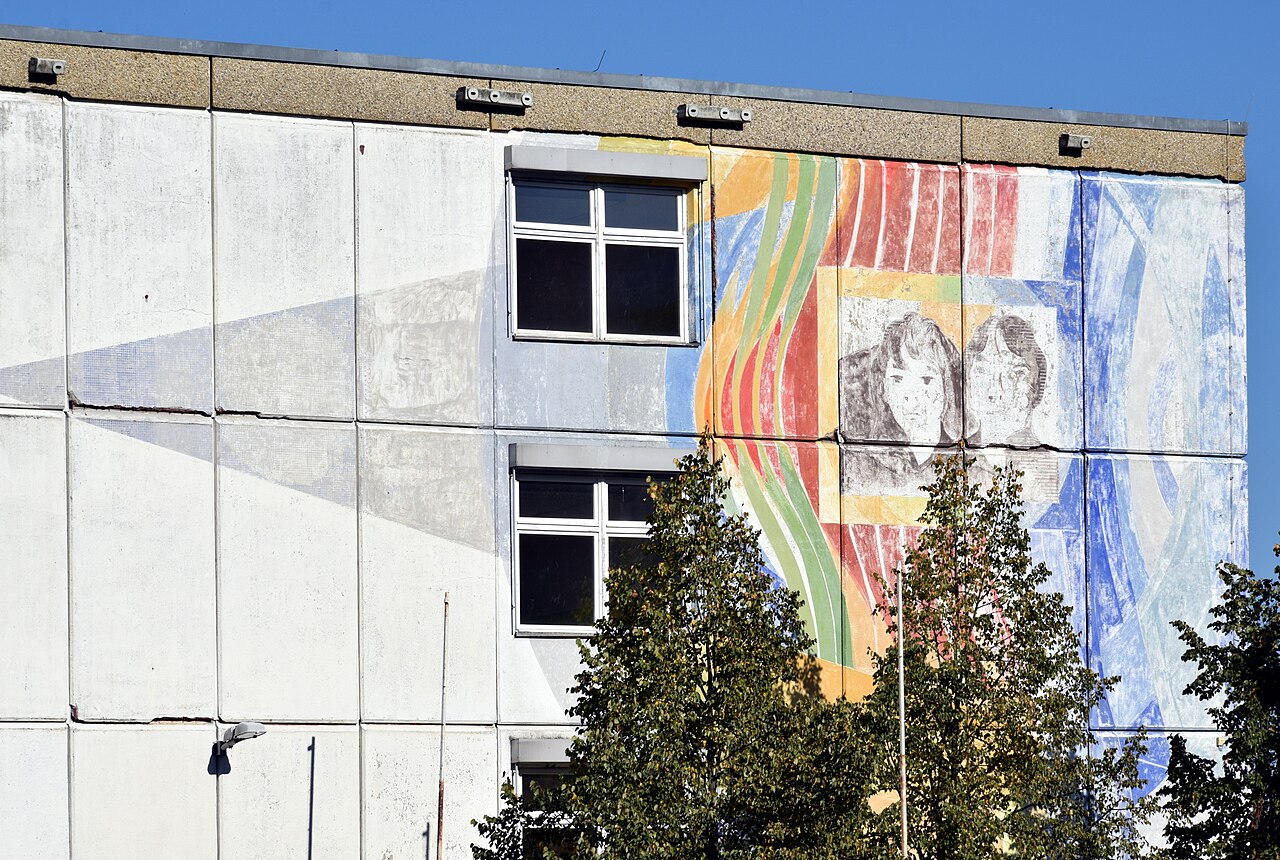 Mural World of Tomorrow by Adam Kurtz on a gable wall of the Kerschensteiner School in Berlin-Marzahn, Germany