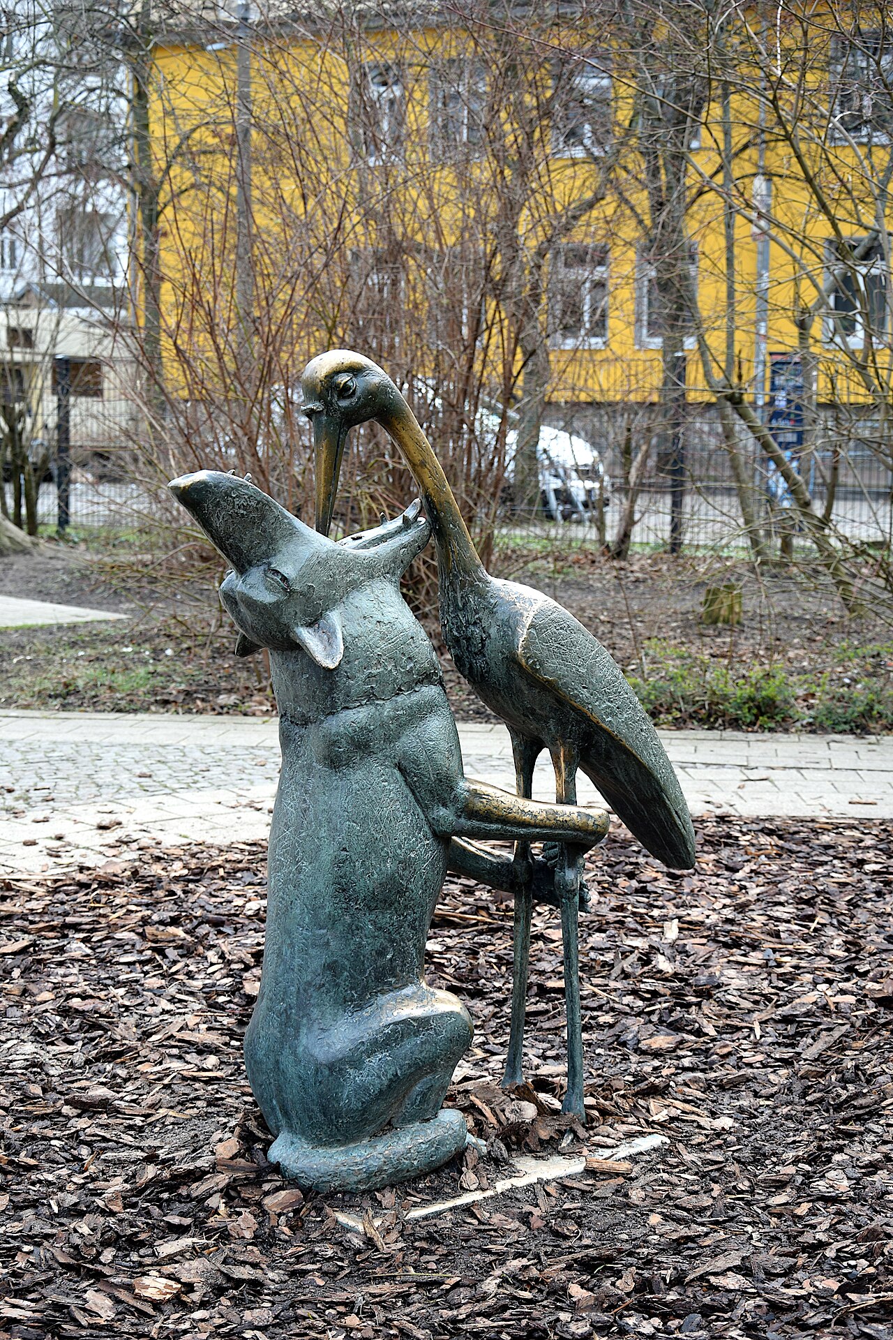 Scilpture "Wolf und Storch" by Stephan Horota at the Lewaldstraße in Berlin-Prenzlauer Berg, Germany